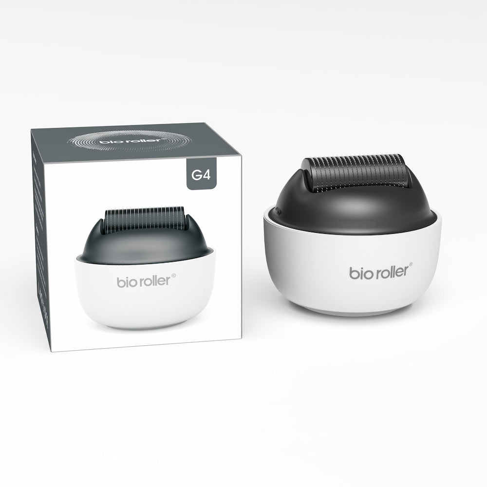Bio Roller G4 microneedling-roller tillsammans med produktförpackningen, designad för ansiktsbehandling, hudföryngring och förbättrad serumabsorption.